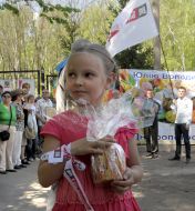 Girl holding a cake