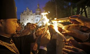 The priest gives Holy Fire