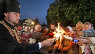 The priest gives Holy Fire