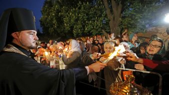 The priest gives Holy Fire