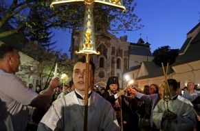 The priest gives Holy Fire