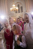 A girl holds a candle