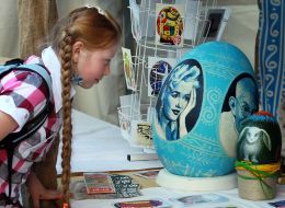 Girl considers Easter Egg