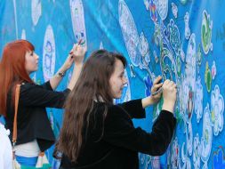 Girls painted designs on canvas