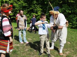 Children study to short a bow