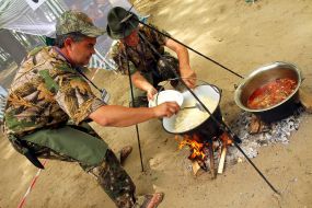 A man prepares goulash