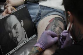 The tattoo artist at work