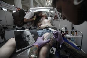 The tattoo artist at work