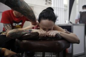 The tattoo artist at work