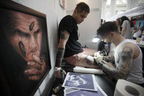 The tattoo artist at work