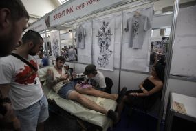 The tattoo artist at work