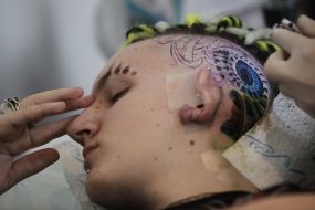 The tattoo artist at work