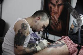 The tattoo artist at work