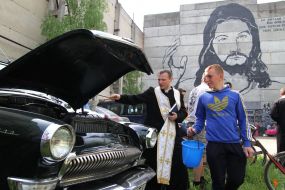 A priest conducts the rite of consecration