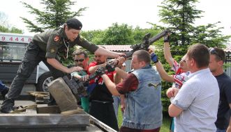 Men are loaded into the machine forged cross