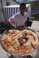 The chef prepares a pilaf
