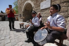 Children play on the drums
