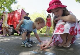Children paint on the pavement