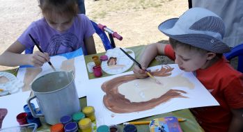Children paint a portrait of mother
