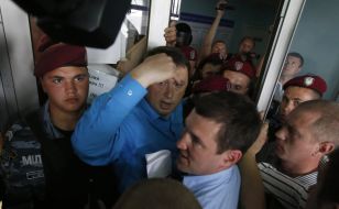 Mykola Melnichenko trying to get to court