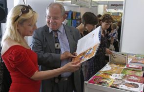 Visitors view the book