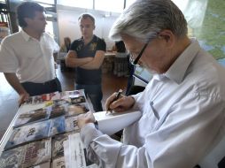 Levko Lukyanenko signs his book