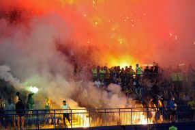 The supporters burn flares