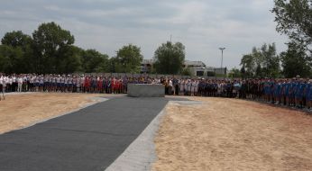 Establishing a capsule in the foundation of a new sports arena