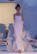 A model shows an evening dress
