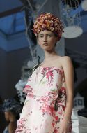 A model shows an evening dress