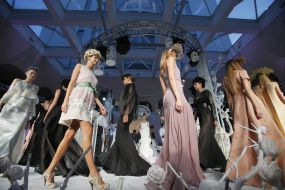 A model shows an evening dress