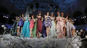 A model shows an evening dress