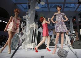 A model shows an evening dress