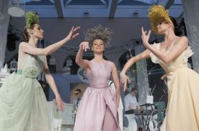 A model shows an evening dress