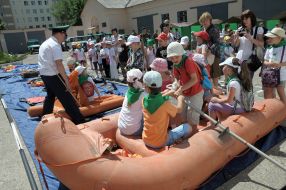 School children sitting in a rubber boat