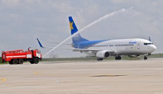 Fire truck watering the plane Boeing737-800NG