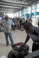 Employee of Kharkiv airport passengers luggage packs