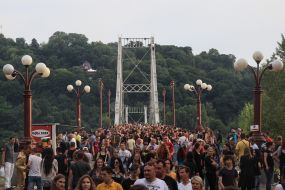 People walk over the footbridge