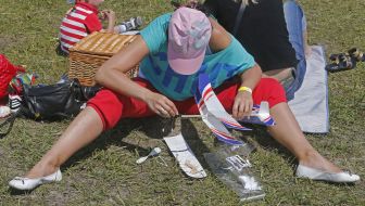 A woman gathers a model airplane