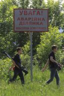 Sign saying "Warning! Alarm site"