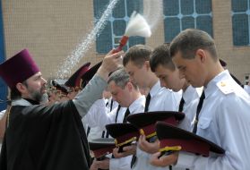 A priest conducts the rite of consecration