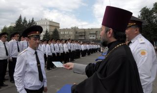 A priest presents a diploma