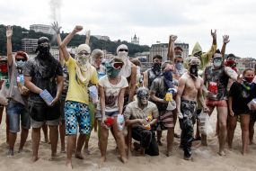 Young people sprinkle each other with flour
