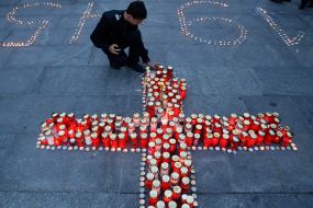 Candles laid out in the form of cross