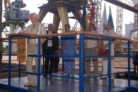 Participants of ceremony of lowering on water of marine tug 