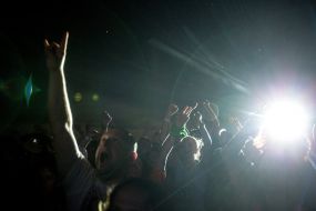 Girls jumping through a haystack