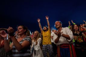 Girls jumping through a haystack