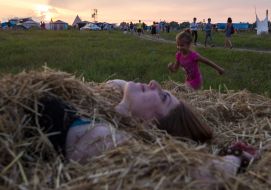 Girl lying in a haystack