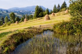 Pond and haystacks