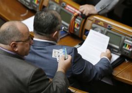 People's deputy holds cards for voting 
